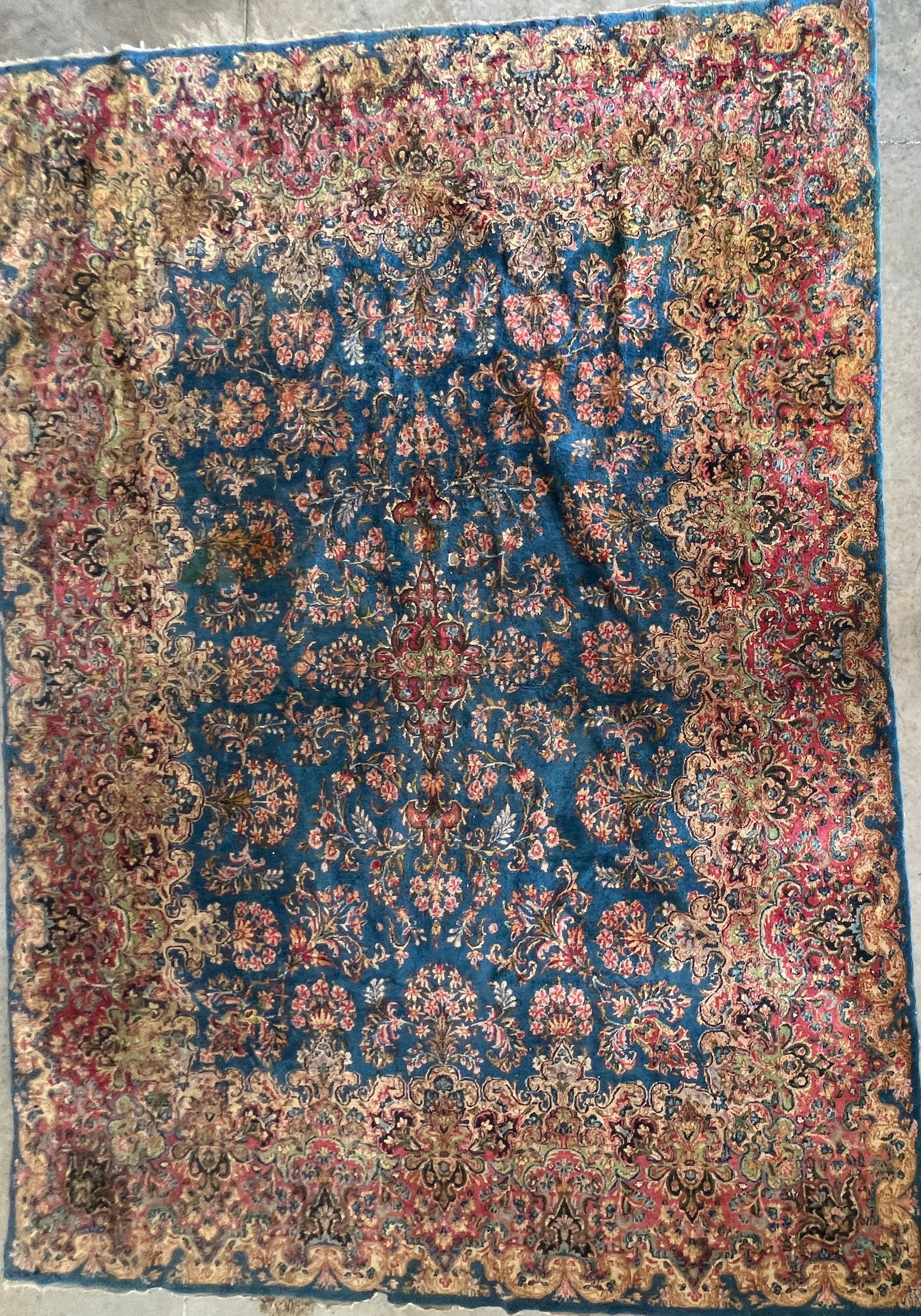 Large Antique Persian Kerman Hand-Knotted Wool Rug, Blue Field Floral Design: Exceptional antique Persian Kerman rug featuring a richly detailed cobalt blue field adorned with an intricate all-over floral and vine pattern centered around an elegant medallion. The expansive fiel