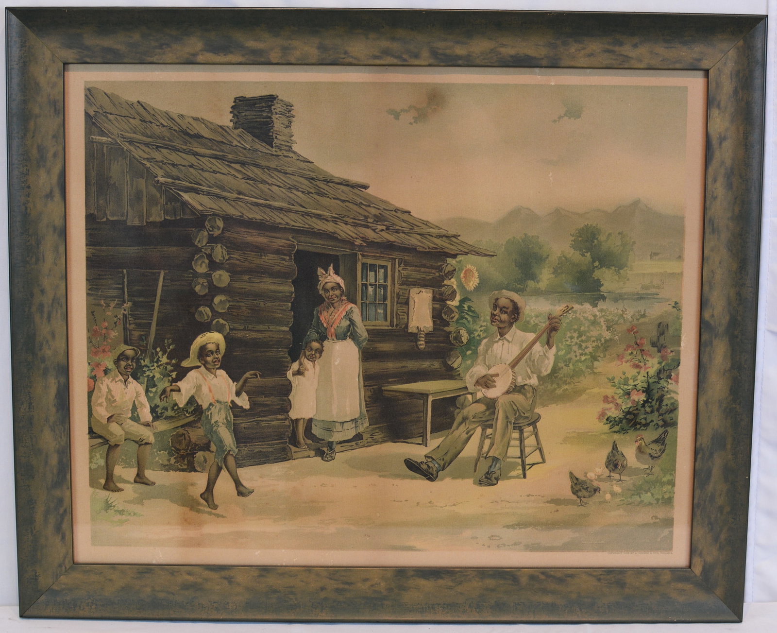 1896 J. Hoover & Son Philadelphia Framed African American Genre Print: Late 19th-century framed chromolithograph depicting an African American family gathered outside a rustic log cabin. The scene features a banjo player entertaining children while a woman and child