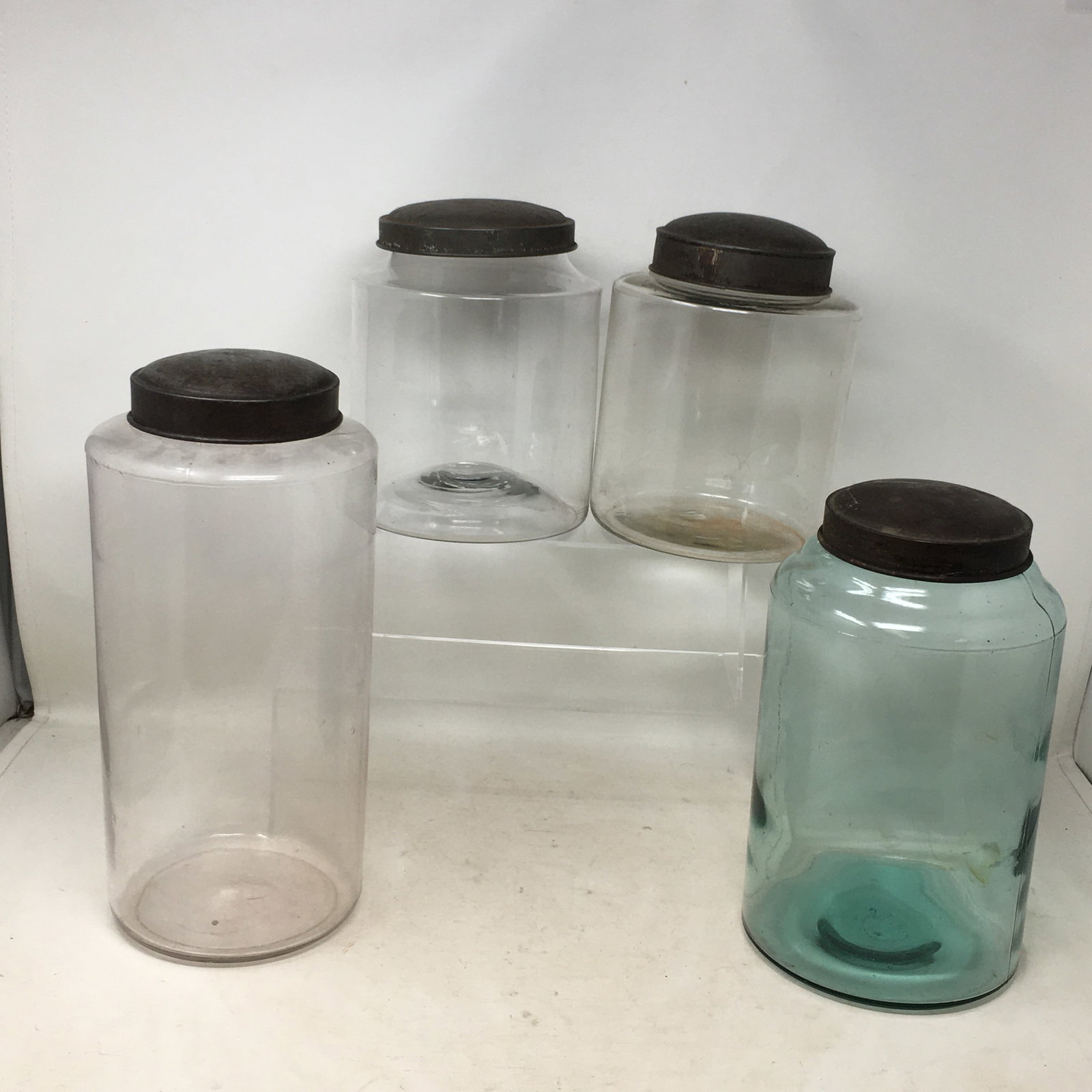 (4) Hand Blown Glass Storage Jars: (4) Hand Blown Glass Storage/Counter Jars with lids. 1 green, 3 clear glass. Tallest 12.5"H.