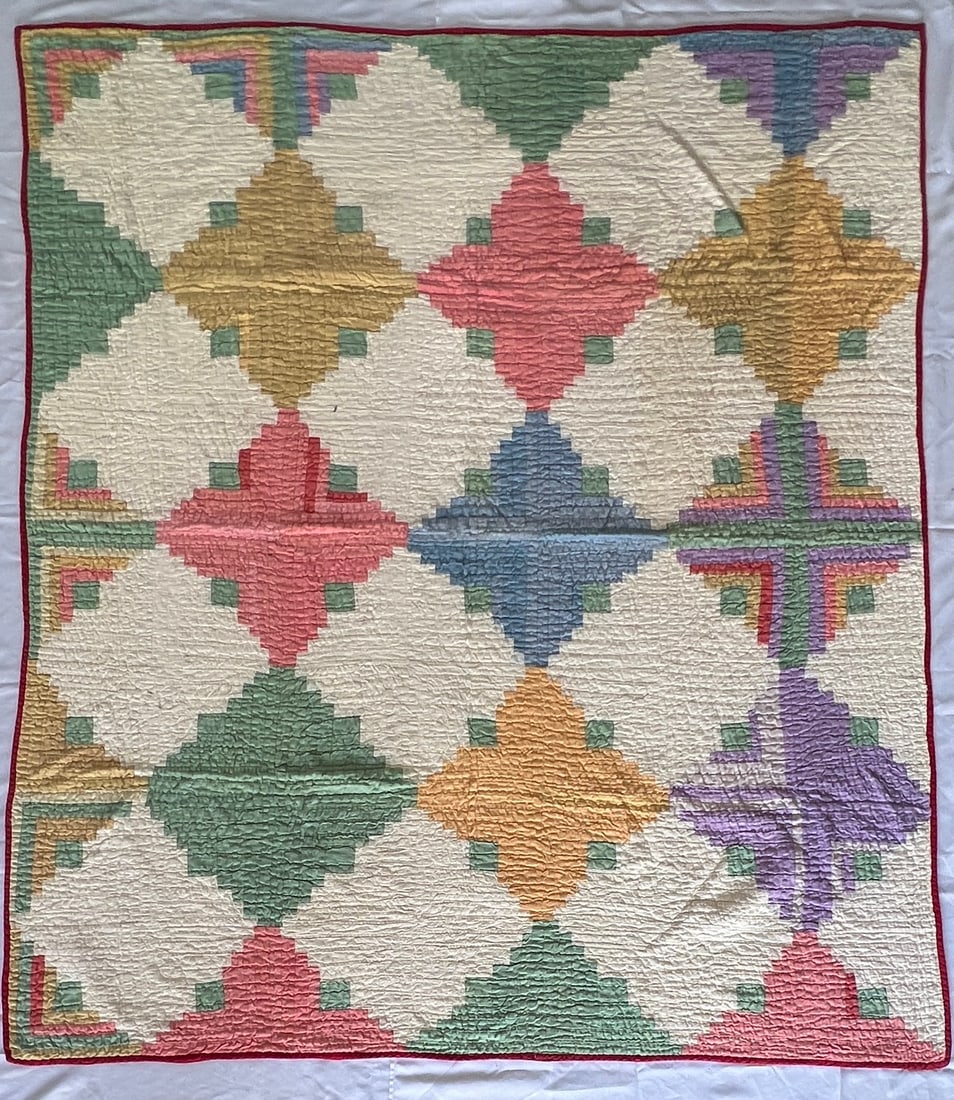 Early Quilt in Barn Raising Pattern in Diamond Layout: Early Quilt in Barn Raising Pattern in Diamond Layout, vibrant colors on well quilted material. 64" X 73"