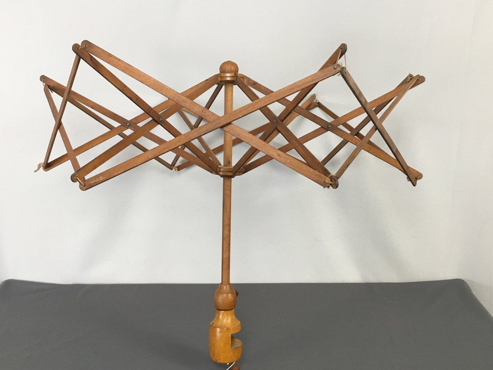 Shaker Wooden Yarn Swift: Shaker Wooden adjustable yarn swift, clamp-on. Damaged thumb screw on clamp. 23.5"H; 29"D when expanded.