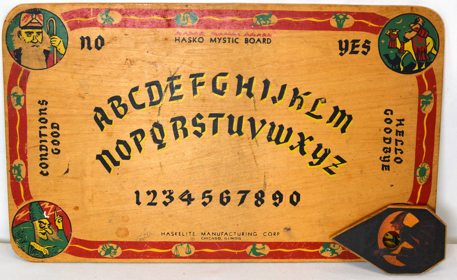 Vintage Hasko Mystic Board with Planchette: Unusual and highly collectible Hasko Mystic Board manufactured by Haskelite Manufacturing Corp., Chicago, Illinois. Featuring colorful occult-themed graphics, alphabet and numeral layout, and