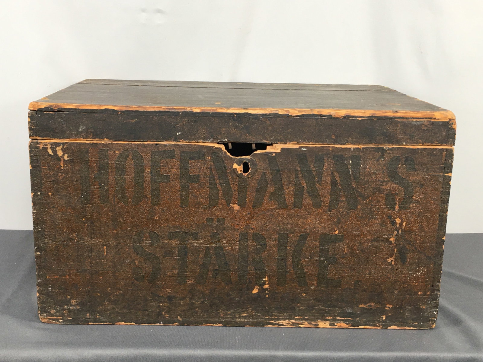 German Advertising Wooden Box: German Dovetailed Wooden Box. Stenciled on front "Hoffman's Starke", which was a German company that produced starch and food chemicals. Scene on inside of lid with German text. Remnants of shipping