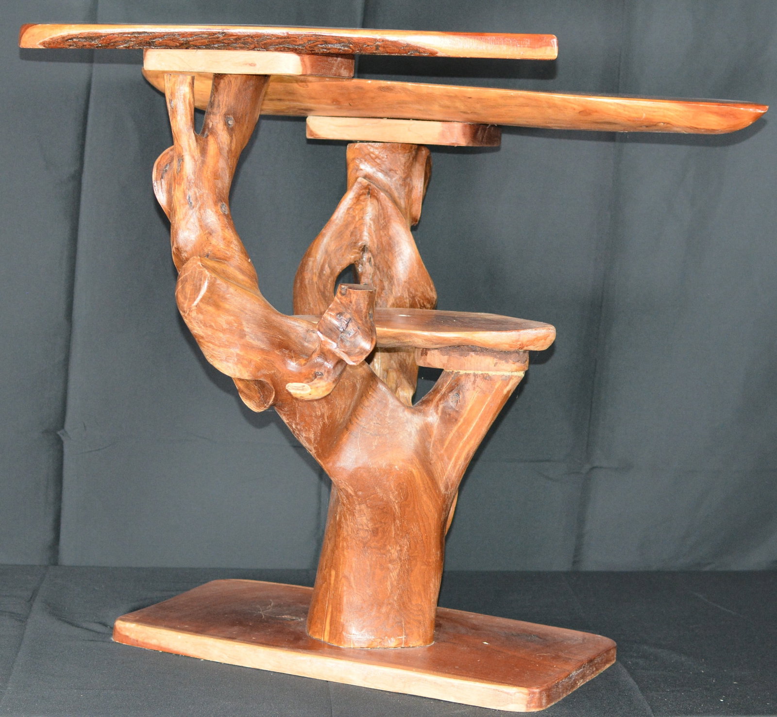 Tiered Root Table with Cherry Wood Tops: Rustic Live-Edge Cedar Tree Form Table. Unique handcrafted rustic furniture set constructed from natural cedar or similar aromatic wood, featuring a sculptural tree-form base incorporating natural lim