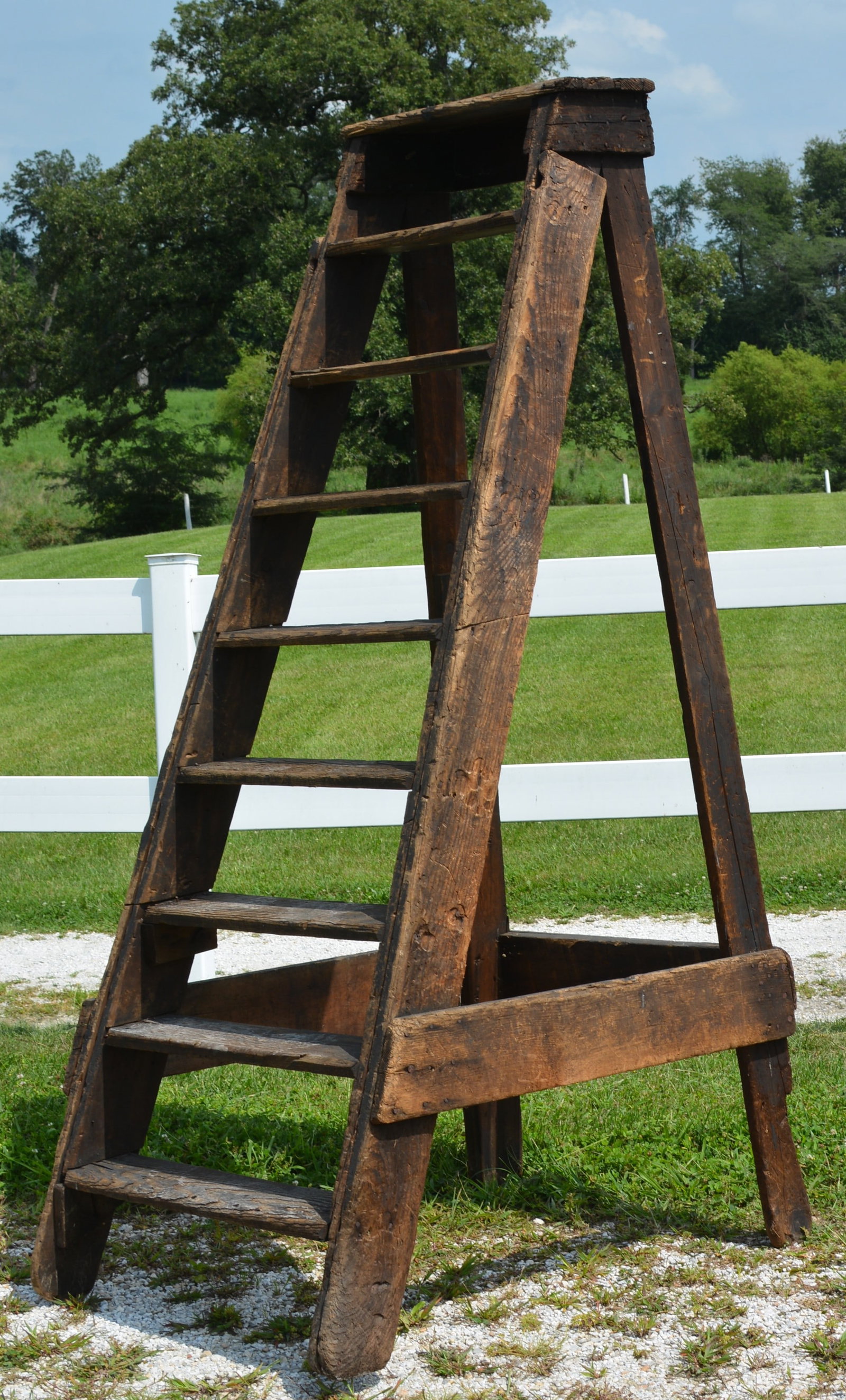 Early Primitive Wooden Orchard / Farm Picking Ladder: Early American primitive wooden orchard or farm ladder constructed of heavy rough-hewn and sawn lumber with a tall A-frame form and multiple wooden steps. 36"W X 6"4"T