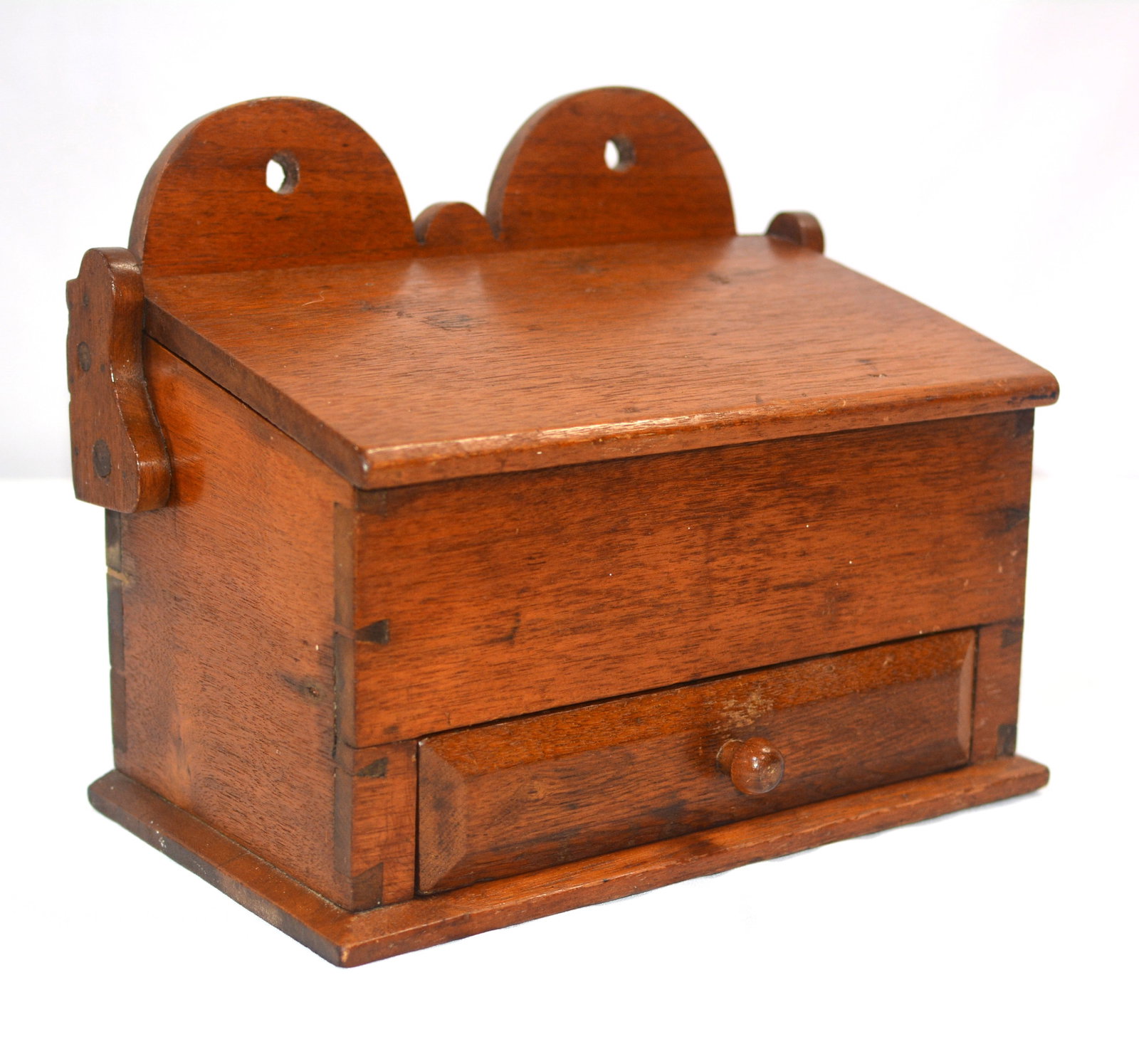 19th Century Dovetailed Walnut Candle Box with Divided Drawer: Fine 19th century American walnut candle or utility box featuring hand-cut dovetailed case construction, a hinged sloping lid, and shaped double-lobed backboard with hanging holes. The lower