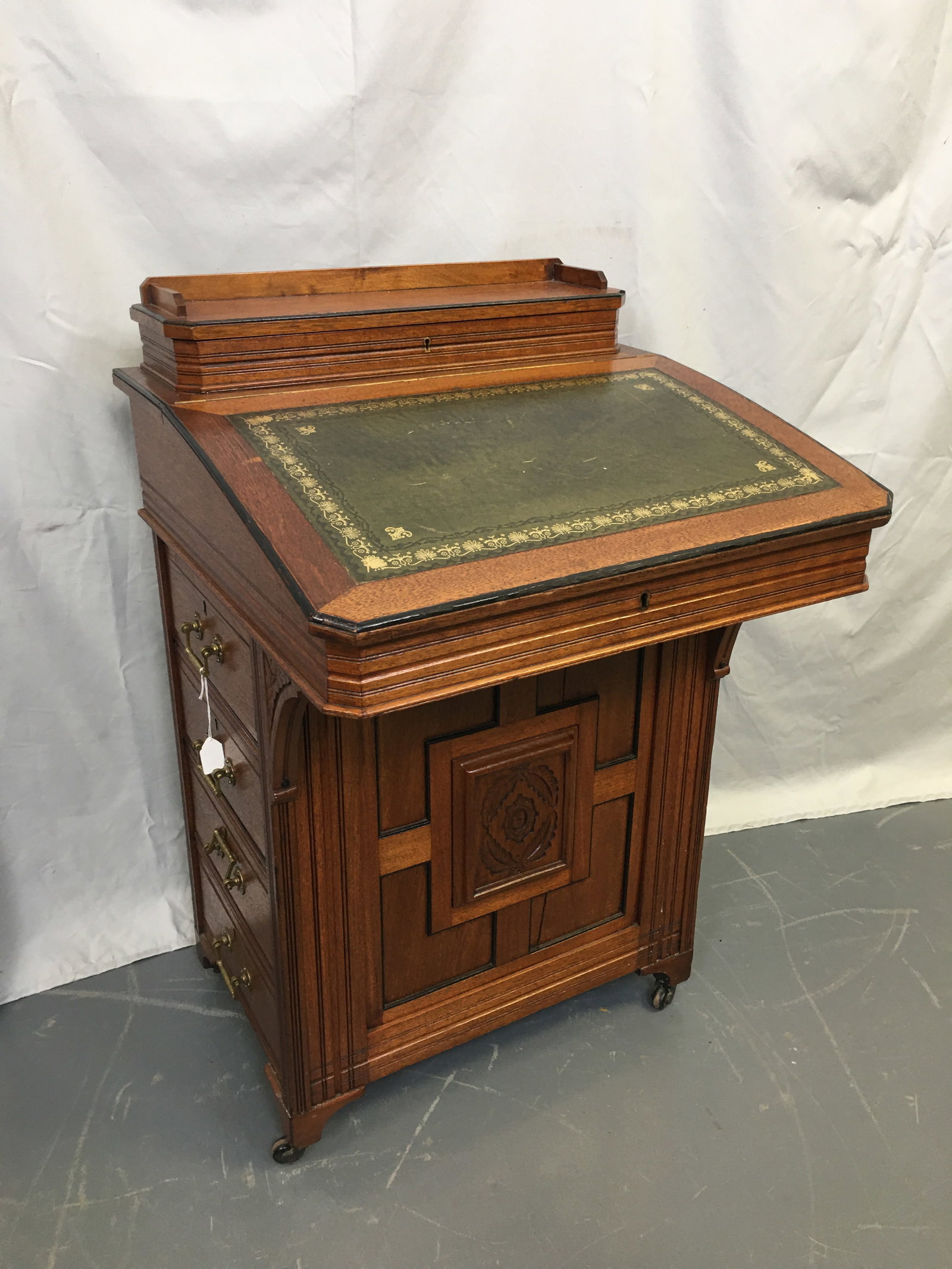 Davenport Desk: Davenport Desk. Four drawers down one side, four false drawers on opposite. Green & gilt tooled leather writing surface flips up, having a bird's eye maple desk interior with two drawers. Gallery rail