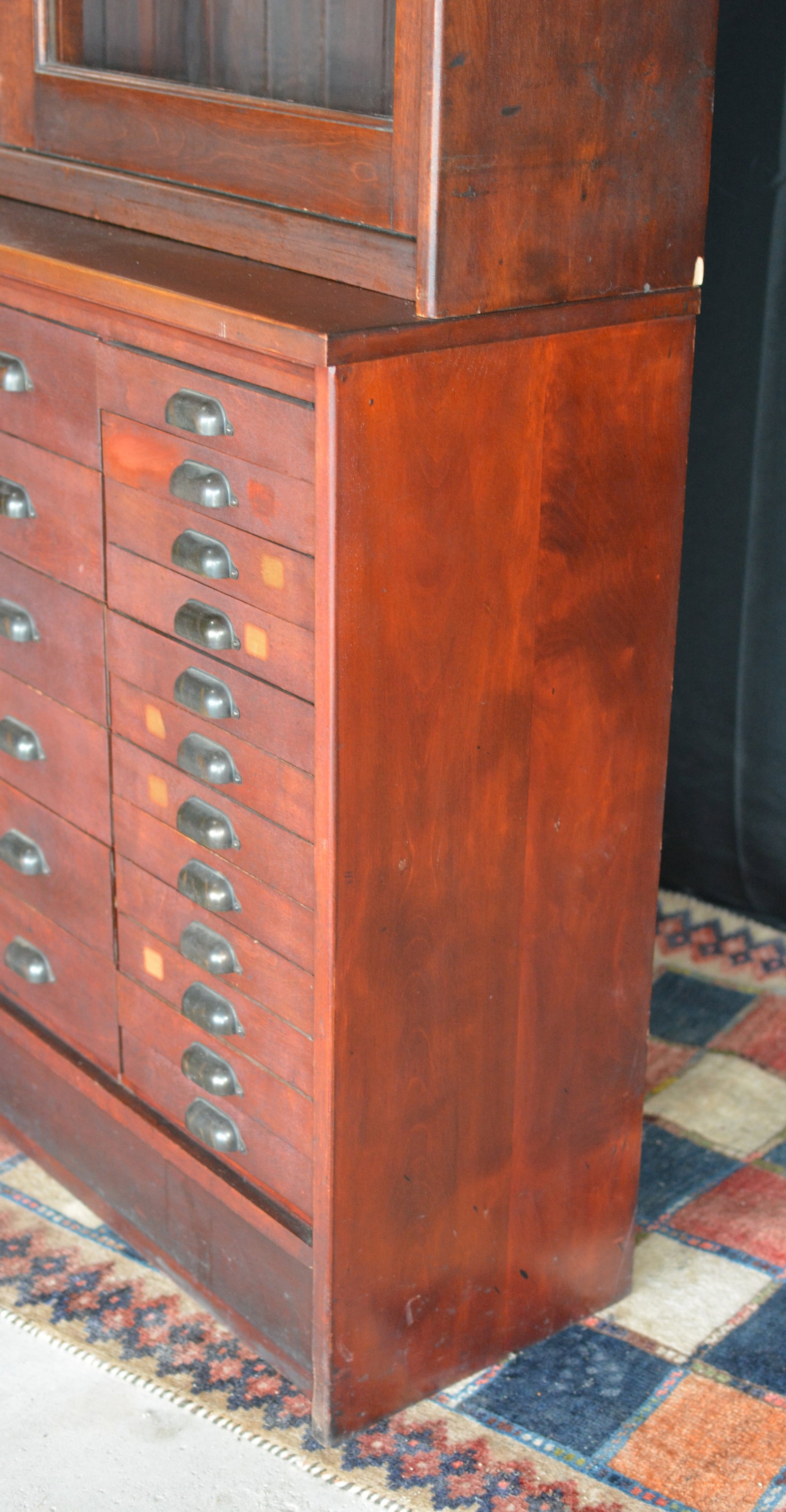 Large Antique Apothecary / Pharmacy Cabinet with Glass Sliding Doors & 36 Drawers: Early 20th-century apothecary, pharmacy, or watch makers cabinet featuring an upper display section with two large sliding glass doors, adjustable shelving and paneled interior, over a substantial ban
