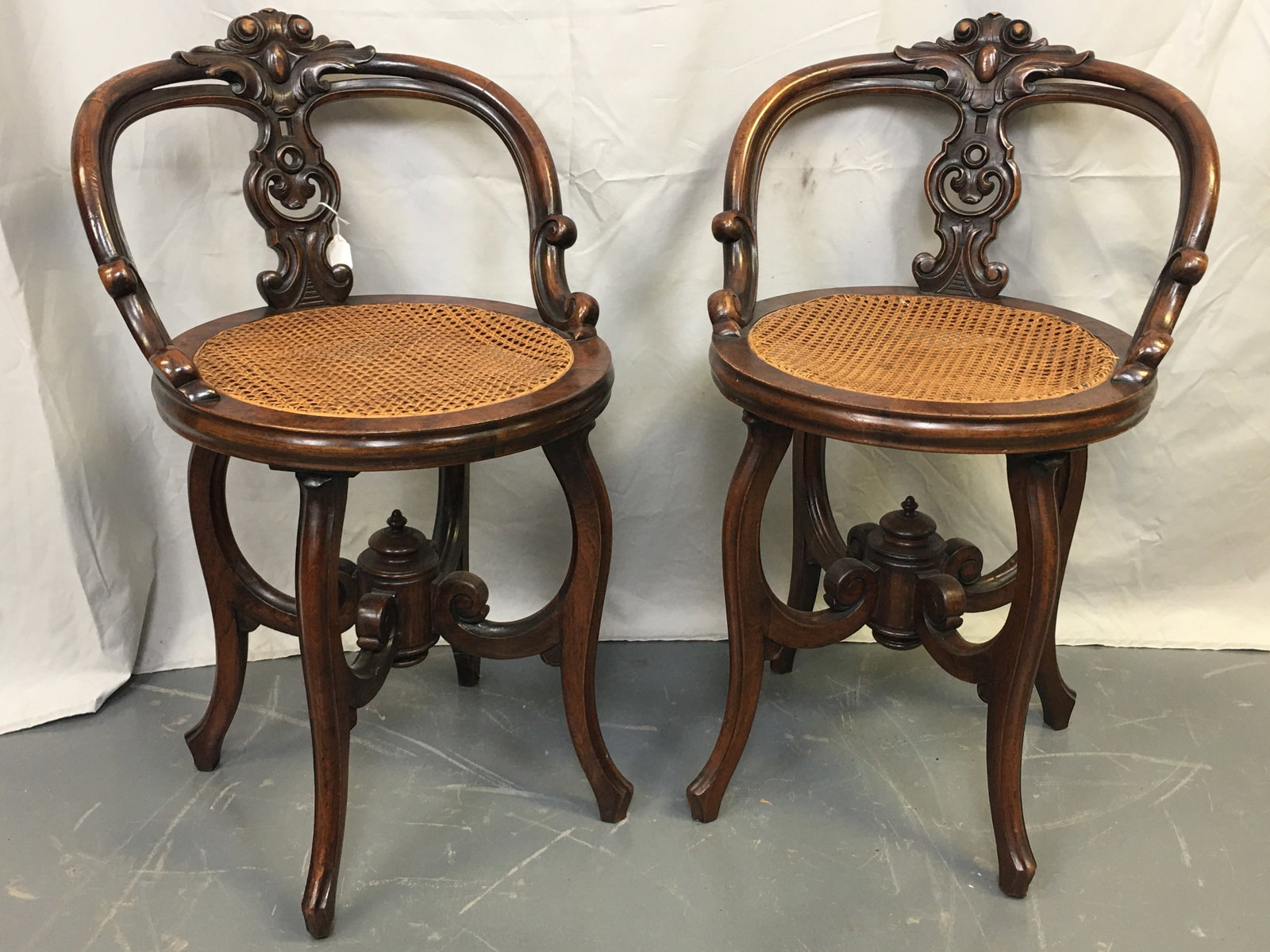 Pair of Carved Cane Seat Chairs: Pair of Carved Cane Seat Side Chairs. 19"W x 18"D x 31"H.