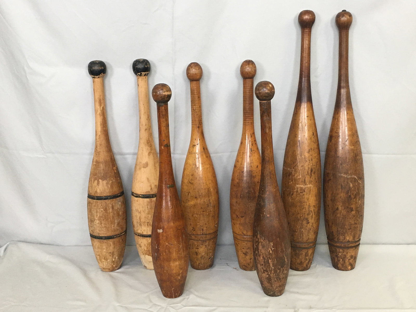 Wooden Indian Clubs: 4 Pairs Turned Wood Indian Clubs or Juggling Pins. One pair marked "3 Lbs". Tallest 24"H