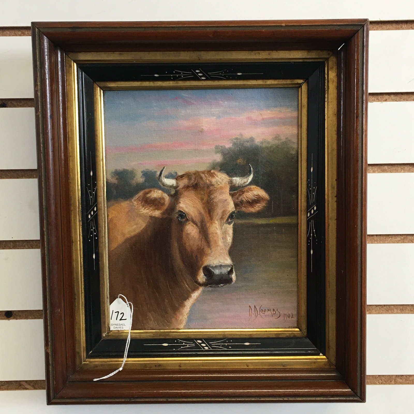 1902 D.D. Coombs O/C: 1902 D.D. (Delbert Dana) Coombs (1850-1938)oil on canvas painting depicting a steer in front of water & trees. Signed and dated in lower right corner. Canvas has depression from behind, no hole but