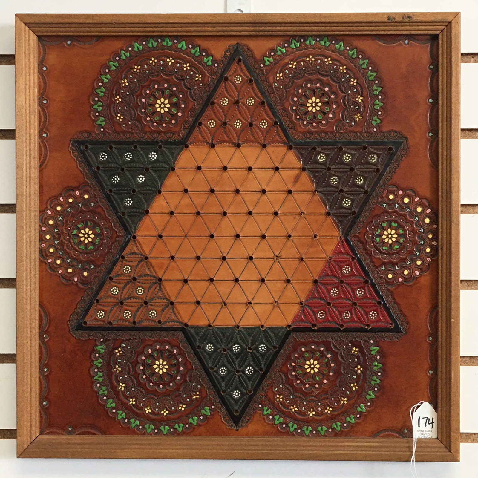 Tooled Leather Chinese Checkers Board: Tooled & Painted Leather Chinese Checkers Board. In frame with leather hook on back for hanging. 17"x17"