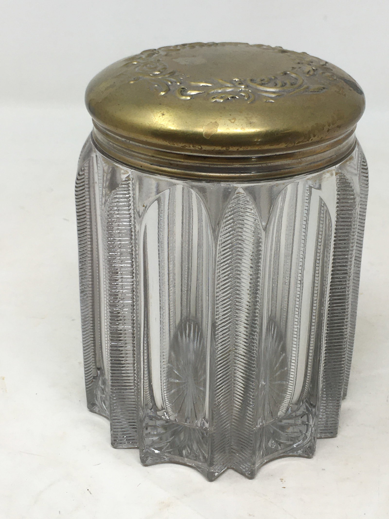 Cut Glass Humidor: Cut Glass Cigar Humidor with embossed brass lid. Vertical channels, every other one cut with ridges. 4.25"D x 5.75"H