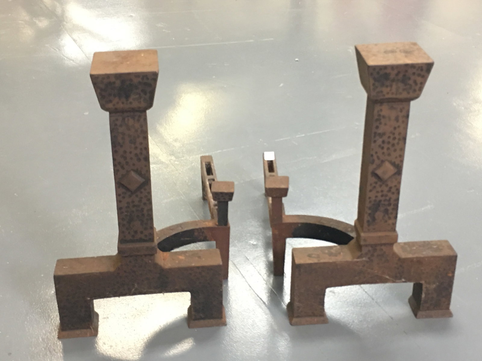 Pair of Adams Hammered Iron Andirons: Pair of Adams Hammered Iron Andirons. Marked Adams 16-18. 12"W x 17"D x 17.5"H