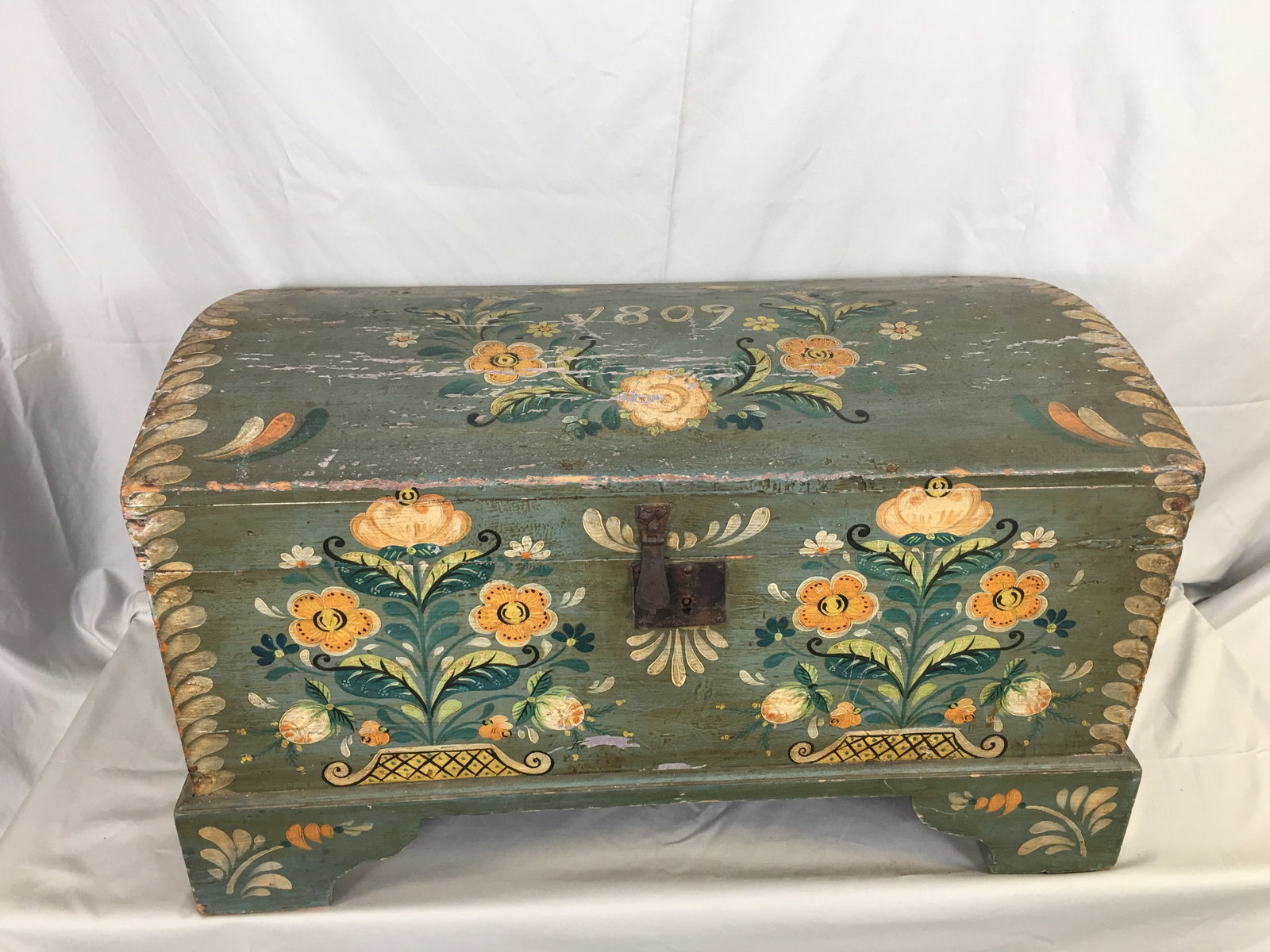Scandinavian Immigrant's Trunk, 1809: Scandinavian Immigrant's Trunk. Dome top trunk painted with decorative floral motif, on a green background with pink interior, marked 1809. 28.25"W x 15.75"D x 17"H.