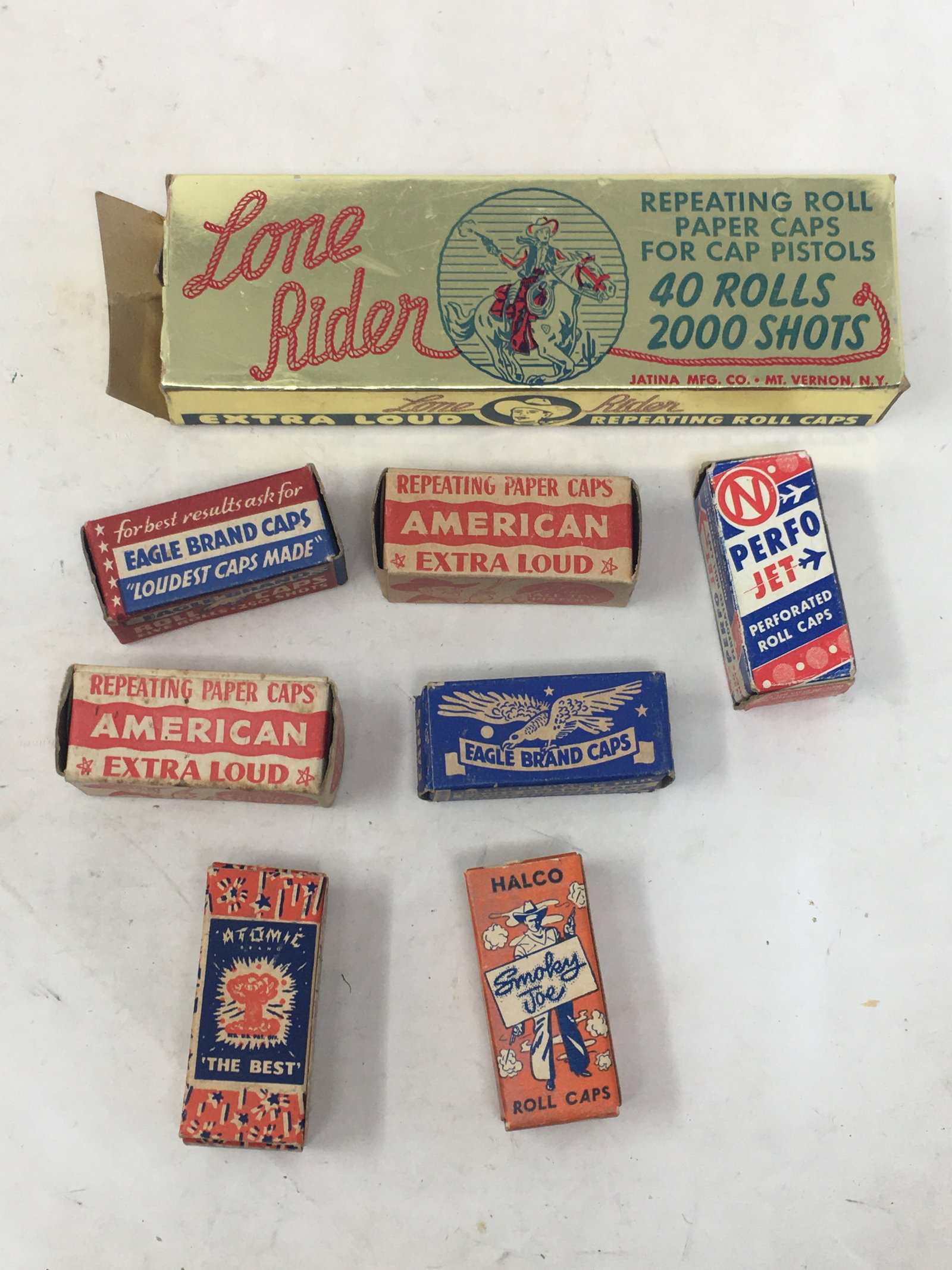 Vintage Cap Gun Caps in Boxes: Vintage Cap Gun Caps in Boxes. Paper roll caps in assorted brands. 7 small, 1 large, all full boxes except one small box is empty. Large box 6.75" x 2" x 1".