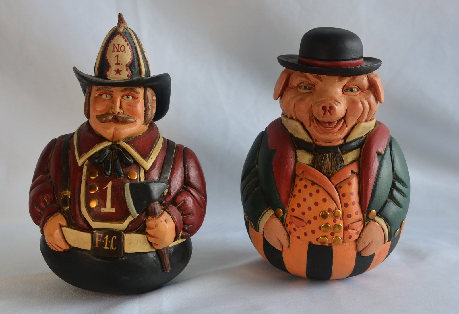 2 Rolly Polly Figures Fireman and Pig: 2 Fork Art Carved Wood Rolly Polly Figures Fireman and Pig. The pig is marked Smith Schrode. 6" X 10"