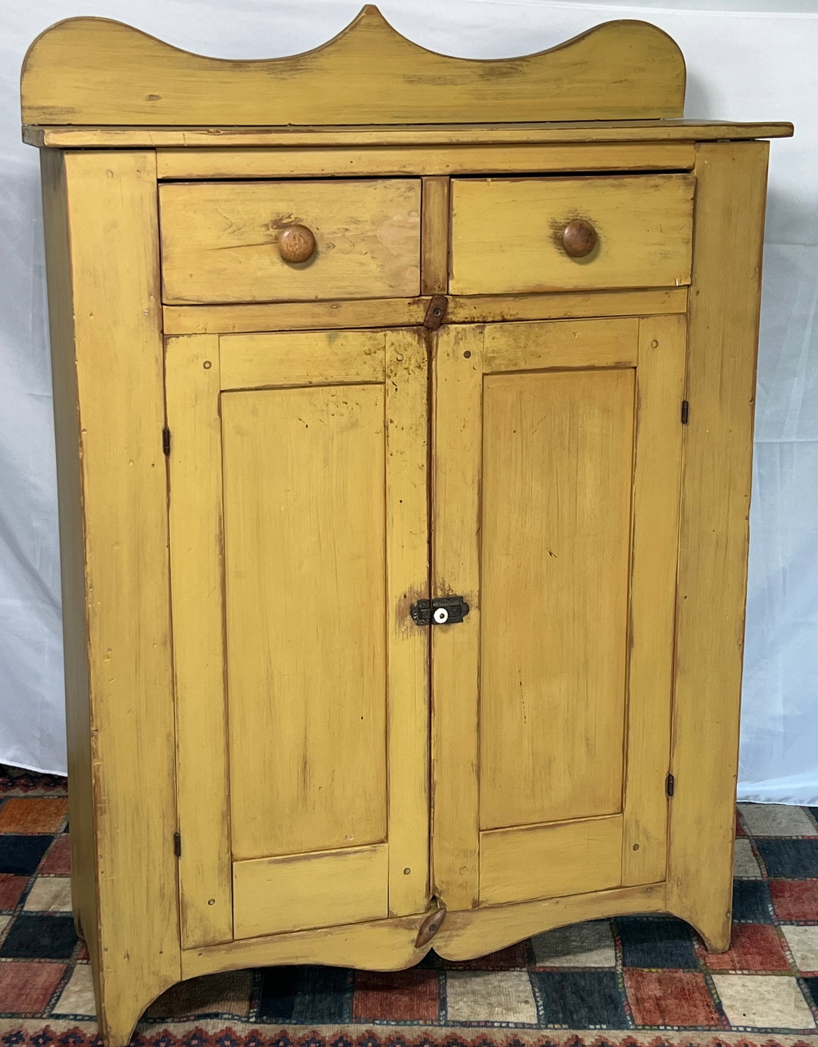 Country Style Painted Jelly Cupboard: Modern country-style jelly cupboard constructed in the manner of a 19th-century American primitive, featuring two upper drawers over paneled double doors and a shaped backsplash and apron. Finished in