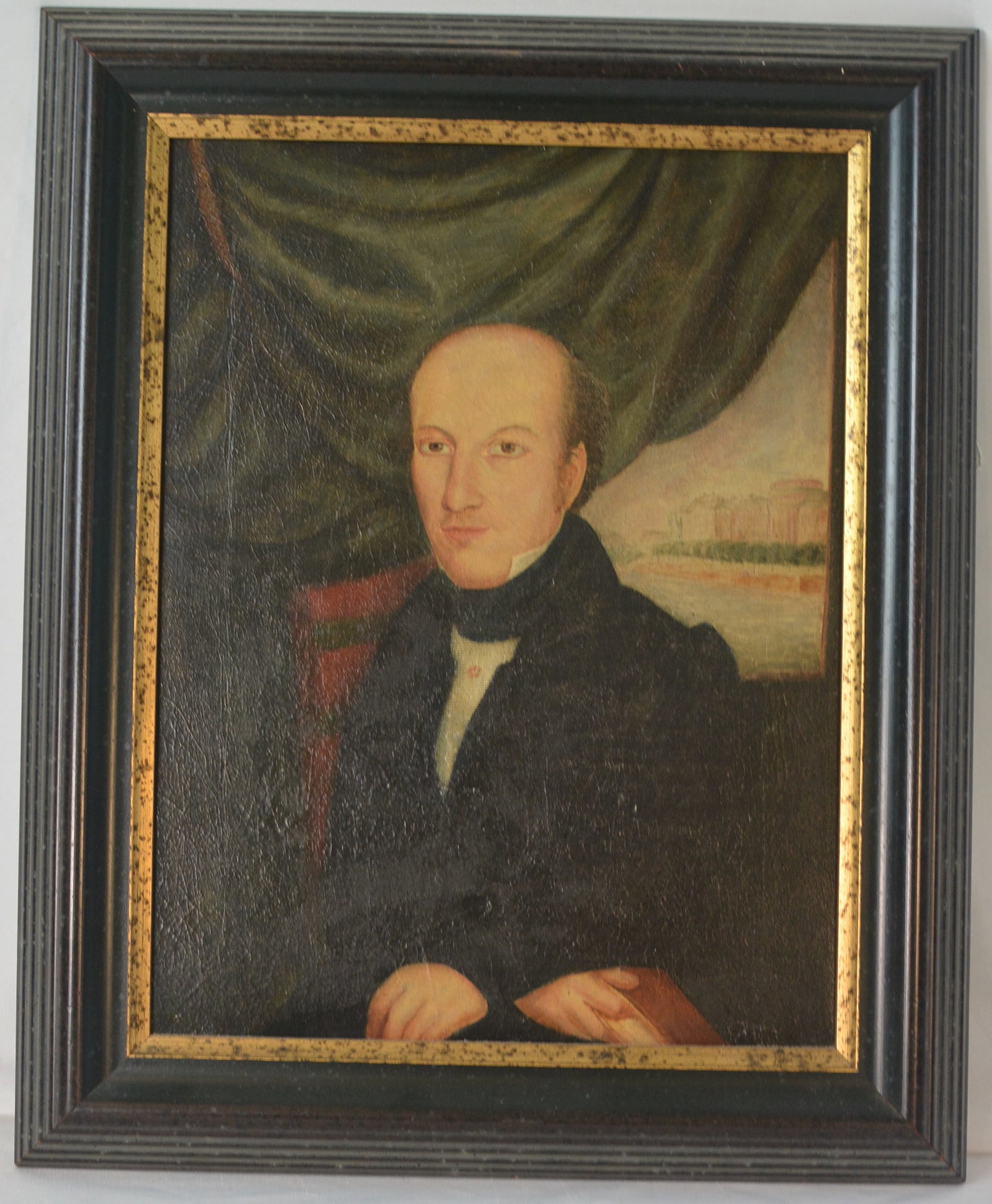 Early 19th Century American Folk Art Portrait with U.S. Capitol Under Construction: Early American oil-on-canvas portrait depicting a finely dressed gentleman seated before a draped interior, with a view of the United States Capitol in Washington, D.C., shown under construction in