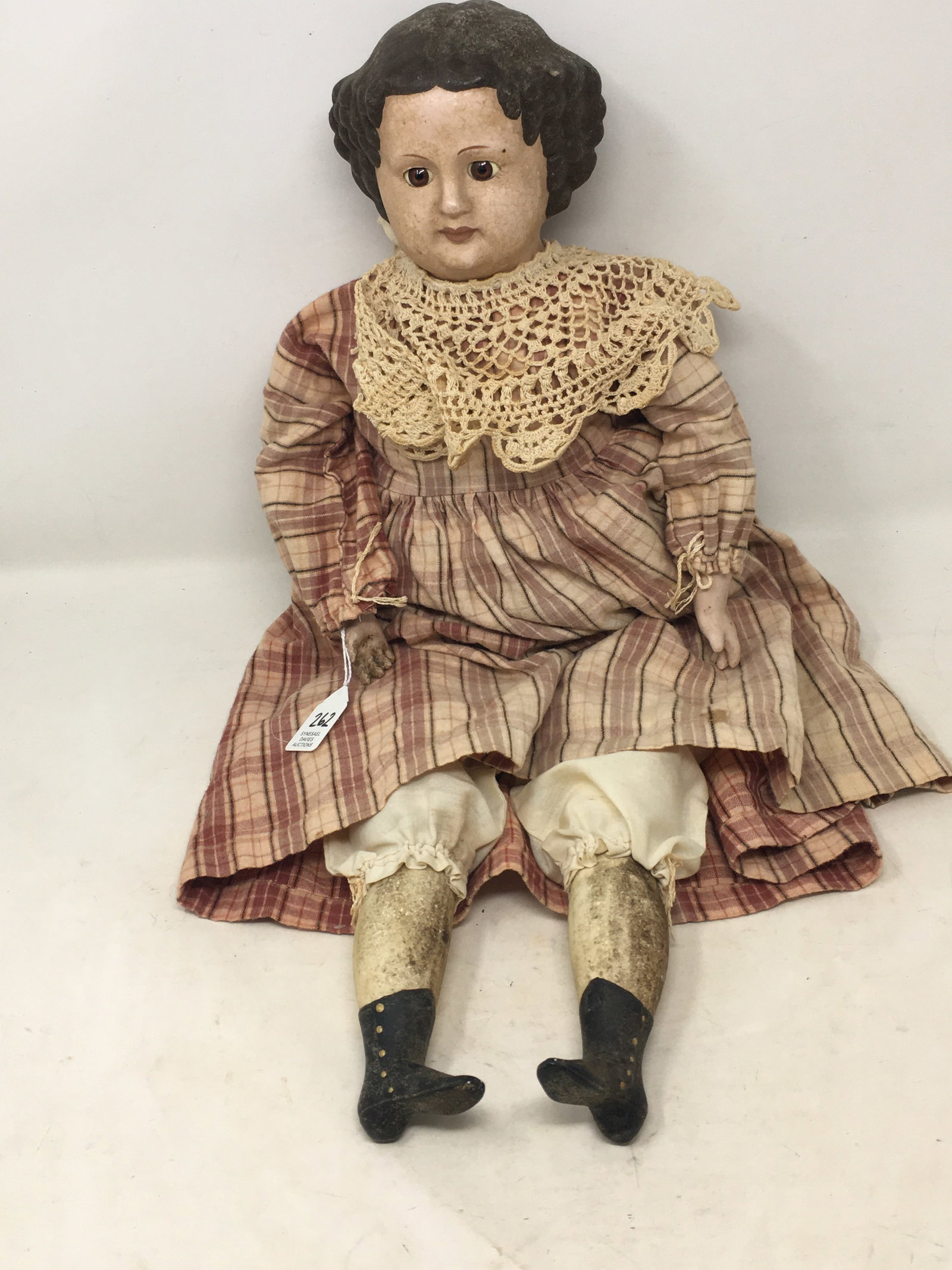 Early Composition Doll: Early Composition Doll, unmarked. Composition head, arms & legs, glass eyes and molded hair. New cloth body signed Donna Gilbert 1996. Crazing. 23.5"L