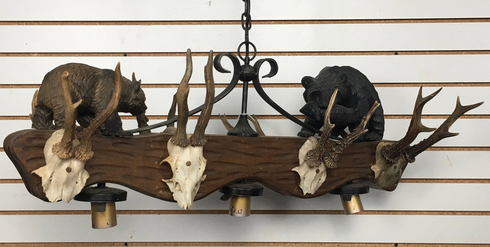 Contemporary Hunting Theme Chandelier: Contemporary Hunting Theme Lodge Chandelier. Wood/wrought iron chandelier with faux antler mounts on both sides, and brown & black bear figures on top. Holds 3 bulbs. Not tested. Approx 32.5"L x 13"D 