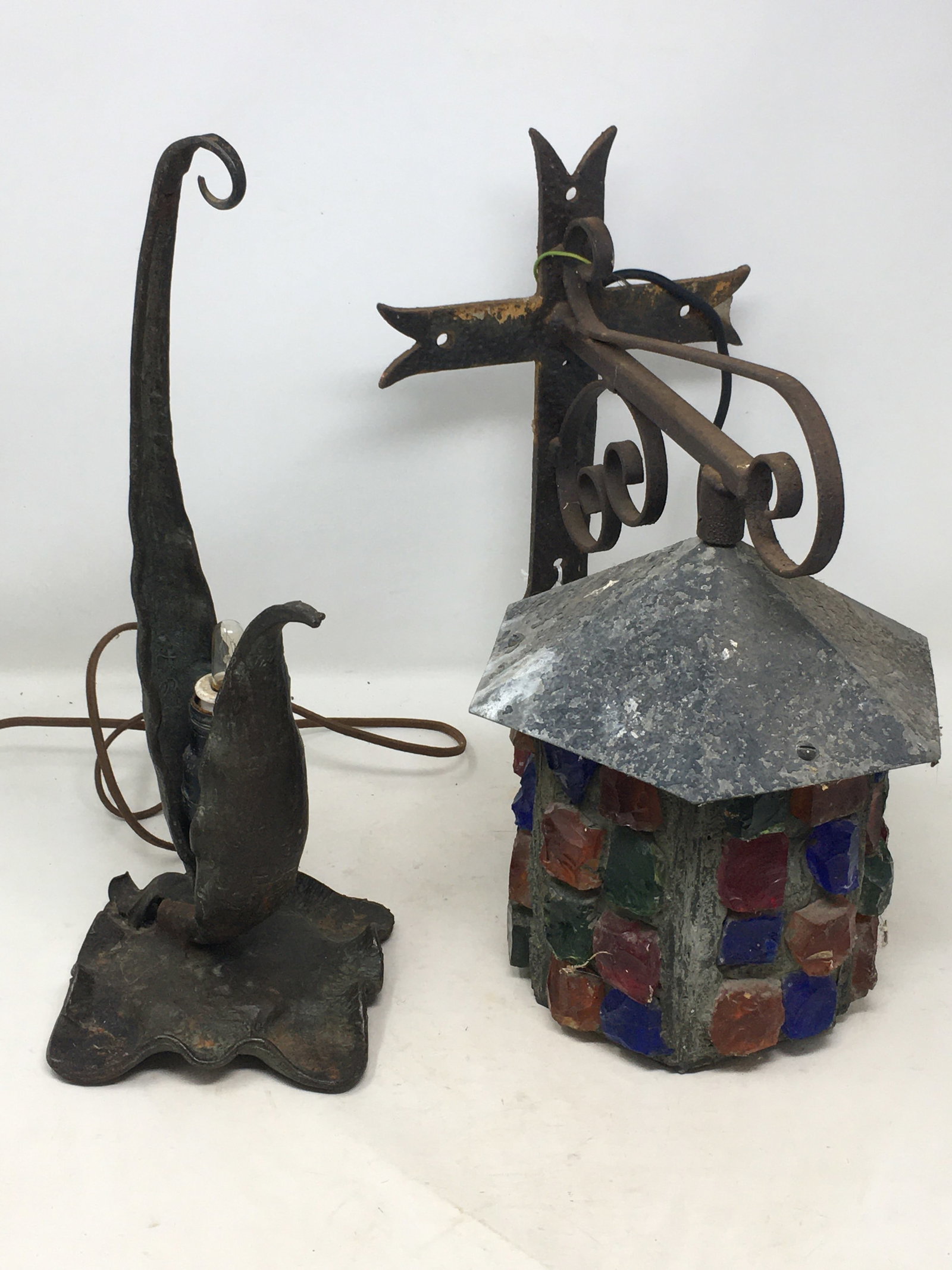 Two Lamps: Two Lamps. 1) A brass plant-form table lamp, marked 0198. 15"H. 2) A hexagonal metal frame sconce lamp, with acrylic gemstones, a tin roof, and wrought iron hanger. 13.5"H to top of bracket.