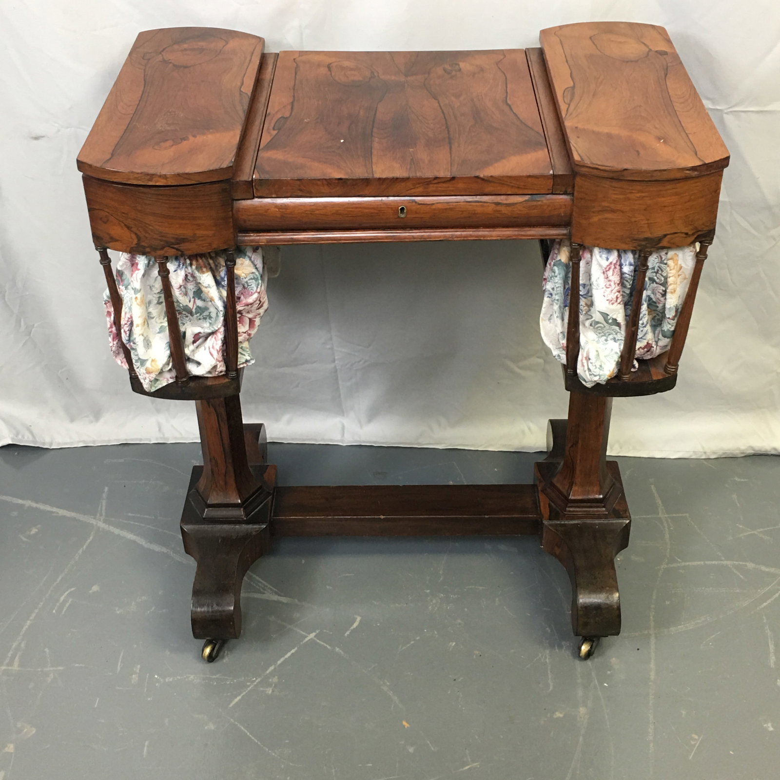 Vanity Desk: Vanity Desk. Center section lifts up, with mirror on back. Tooled leather writing surface inside which can also lift up and be propped in place at desired angle. Spindled ends with a flip top lid abov