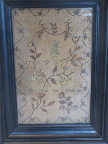 Sampler on linen w/ fine needlework: Sampler on linen w/ fine needlework flowers, vining border, leaves, signed by Mary Nicolls, Her Work, 1817, 7 1/2" x 11 3/4", black molded frame, no holes, $600-800