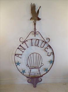 Wrought iron folk art "Antiques" trade sign: Wrought iron folk art "Antiques" trade sign, approximately 60 years old, handcrafted w/ sheet iron eagle at top and Windsor armchair flanked by 4 blue painted stars, 38"w. x 80" t. very good condition