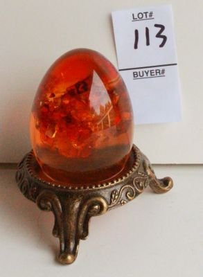 113. Vintage amber egg on stand.: Measure 3 inches tall.