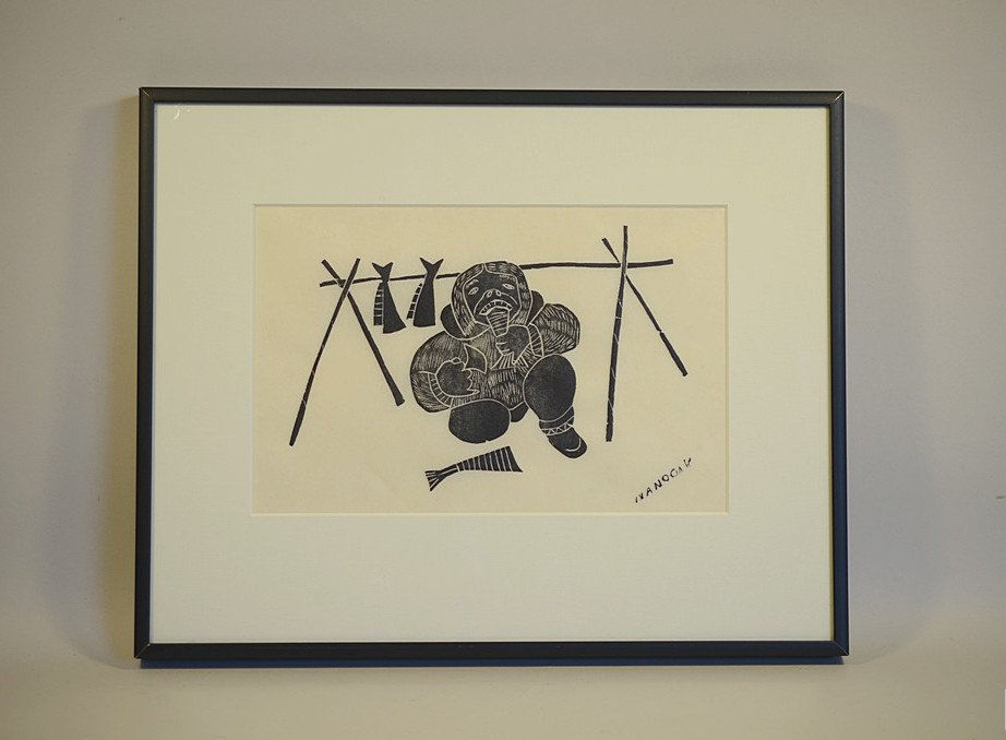 Agnes Nanogak (1925-2001) Stonecut -- Traditional Inuit: DESCRIPTION: Agnes Nanogak (1925-2001) Stonecut -- Traditional Inuit Scene of Hunter & Fish.Plexi-glass gallery framing, high quality paper: Label on reverse from the:"Arctic Loon Gallery, Kenneth