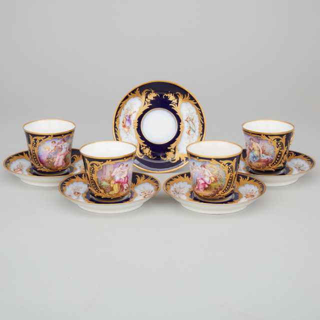 Four 'Sèvres' Blue Ground Cups and Five Saucers, F.: Lot 258 Four 'Sèvres' Blue Ground Cups and Five Saucers, F. Lacoste, late 19th century cup height 2.4" — 6.2 cm. cups signed F. Lacoste, monogram with DORE A SEVRES and 78 in red, S.64 in green Est
