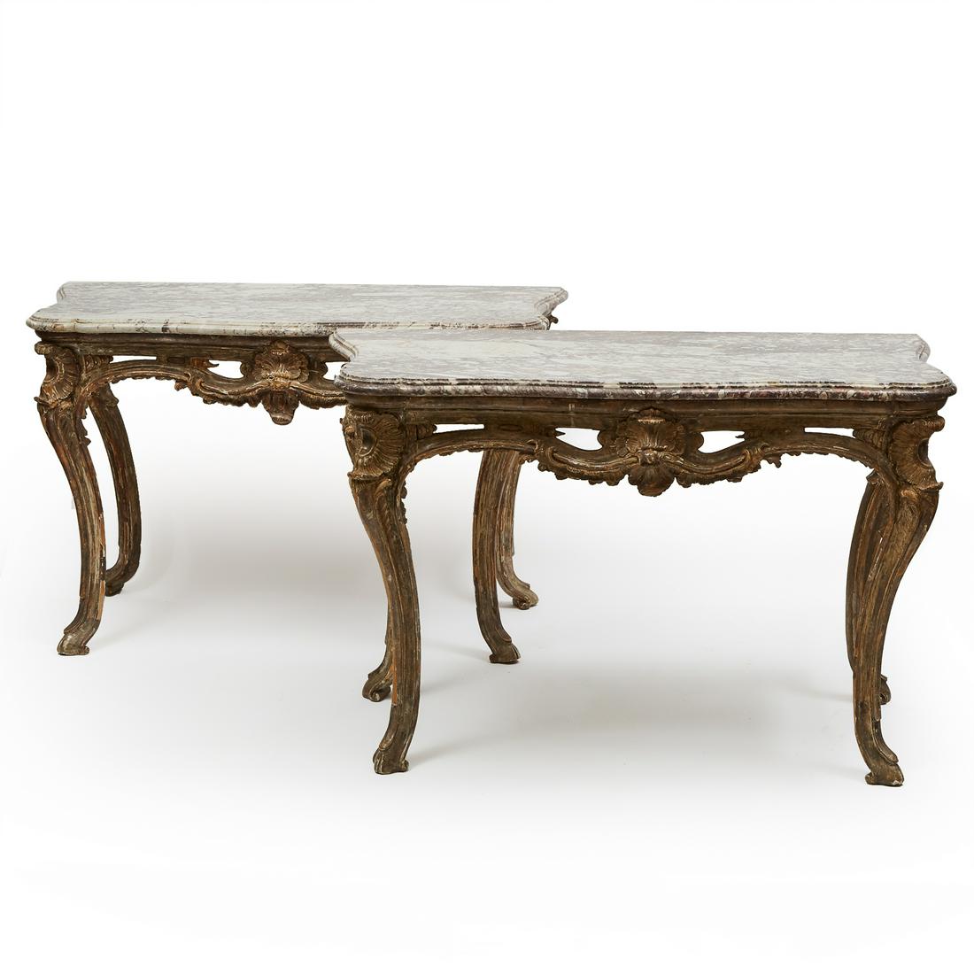 Pair of Italian Rococo Silver Gilt Console Tables, mid: Pair of Italian Rococo Silver Gilt Console Tables, mid 18th century each breccia marble top of serpentine outline on a robustly pierce carved rocaille work frame raised on cabriole legs 35.5 x 55.5 x