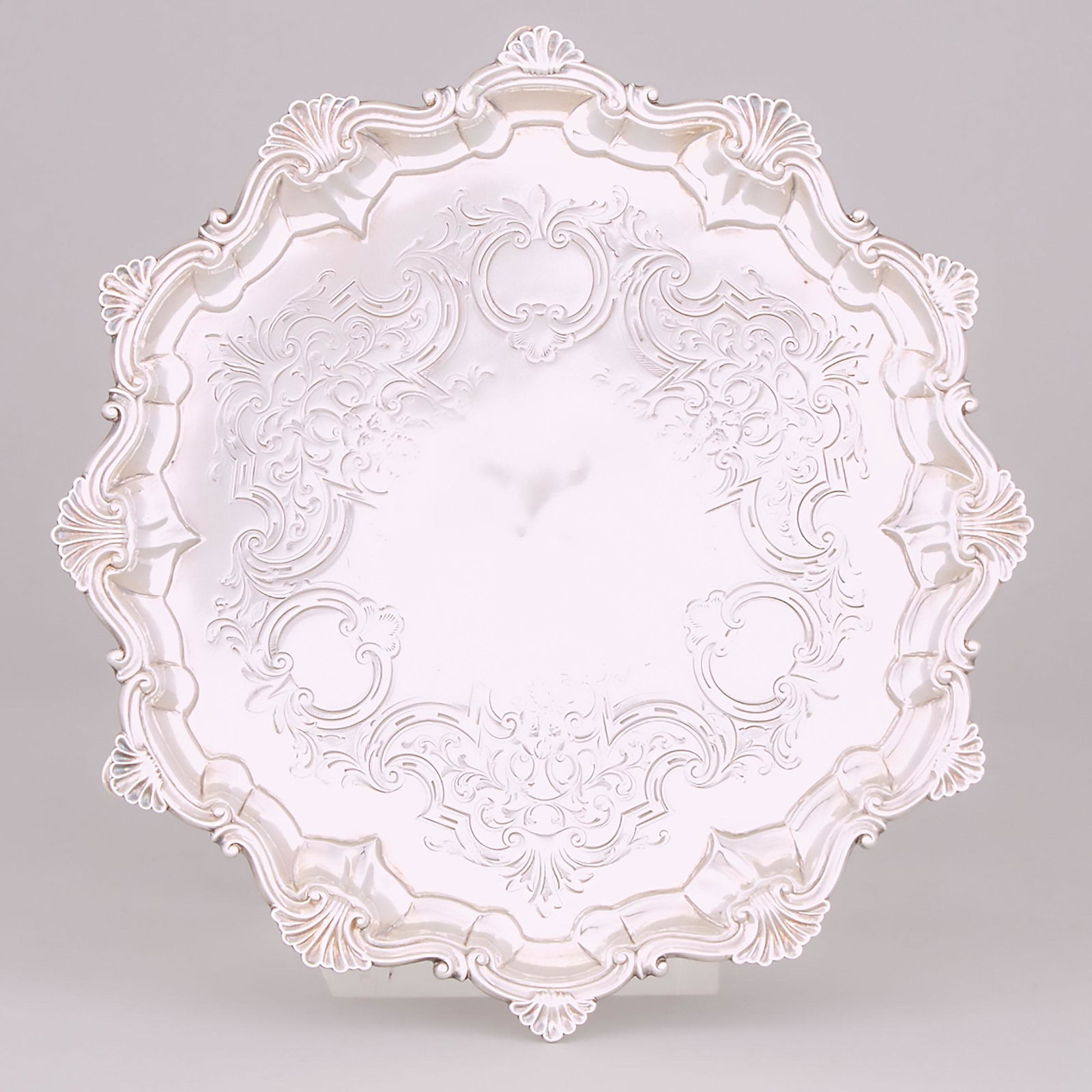 Victorian Silver Shaped Circular Salver, John S. Hunt,: Victorian Silver Shaped Circular Salver, John S. Hunt, London, 1857 diameter 10 in — 25.5 cm, 17.6 oz. — 547 grams Estimate: $300—500