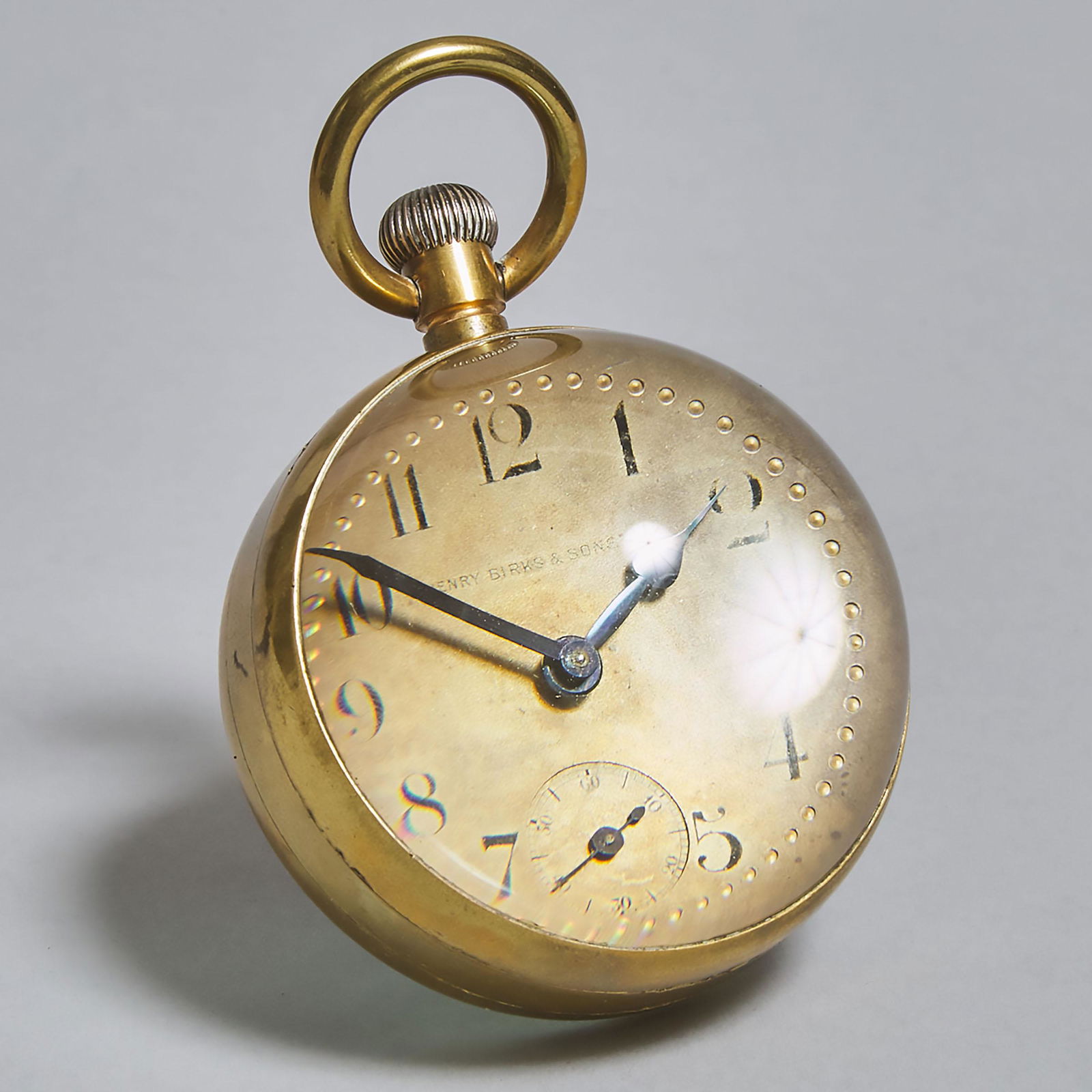 Swiss Ball Clock, early 19th century, diameter 2.75 in: Swiss Ball Clock, early 19th centurythe silvered dial with retailer 'Henry Birks & Sons L' fronting an 8-day jewelled bridge-plate movement, diameter 2.75 in — 7 cmEstimate: $200—300
