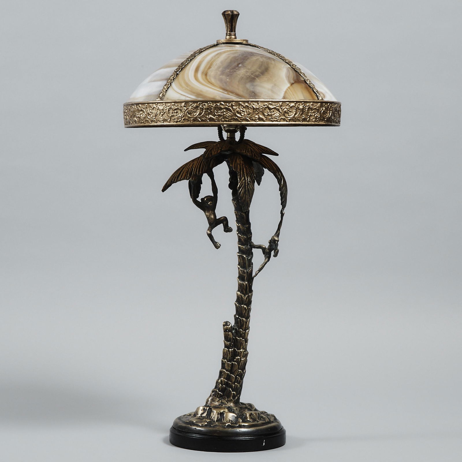 Frederick Cooper Bronze Table Lamp Base, late 20th: Frederick Cooper Bronze Table Lamp Base, late 20th centurymodelled as a palm tree with monkeys and coconuts, with associated slag glass shade, height 28 in — 71.1 cmEstimate: $200—300