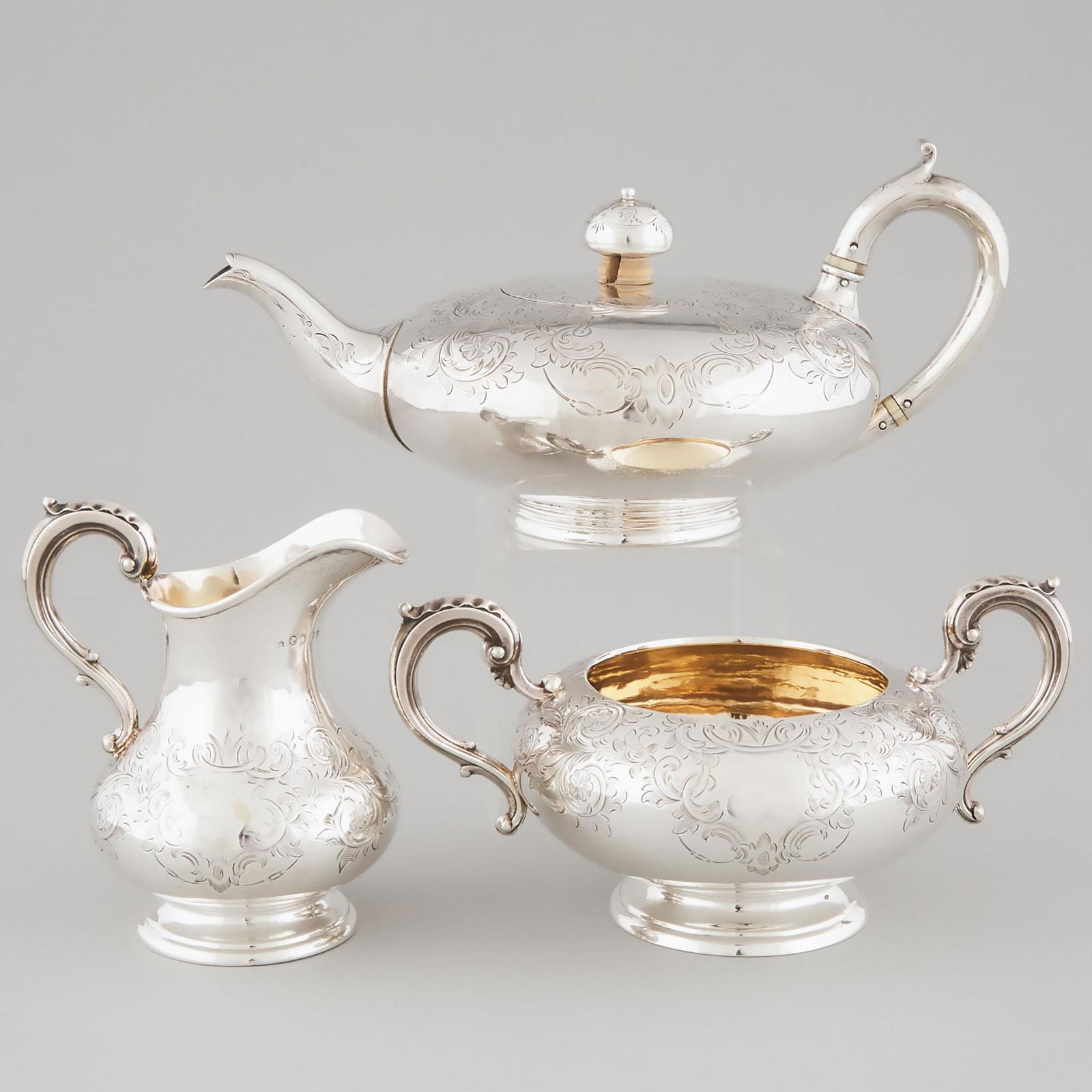 Victorian Irish Silver Tea Service, Robert W. Smith,: Victorian Irish Silver Tea Service, Robert W. Smith, Dublin, 1853/55comprising three pieces, cream jug height 5.5 in — 13.9 cm, 43.6 oz. — 1357 gramsNote:Contains material which may be sub