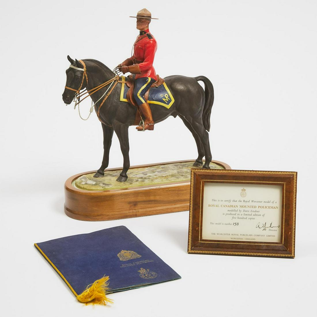 Royal Worcester Model, ‘Royal Canadian Mounted Policeman’,: Royal Worcester Model, ‘Royal Canadian Mounted Policeman’, 158/500, Doris Lindner, c.1966with wood base, booklet and certificate, overall height 12.2 in — 31 cm, printed and painted
