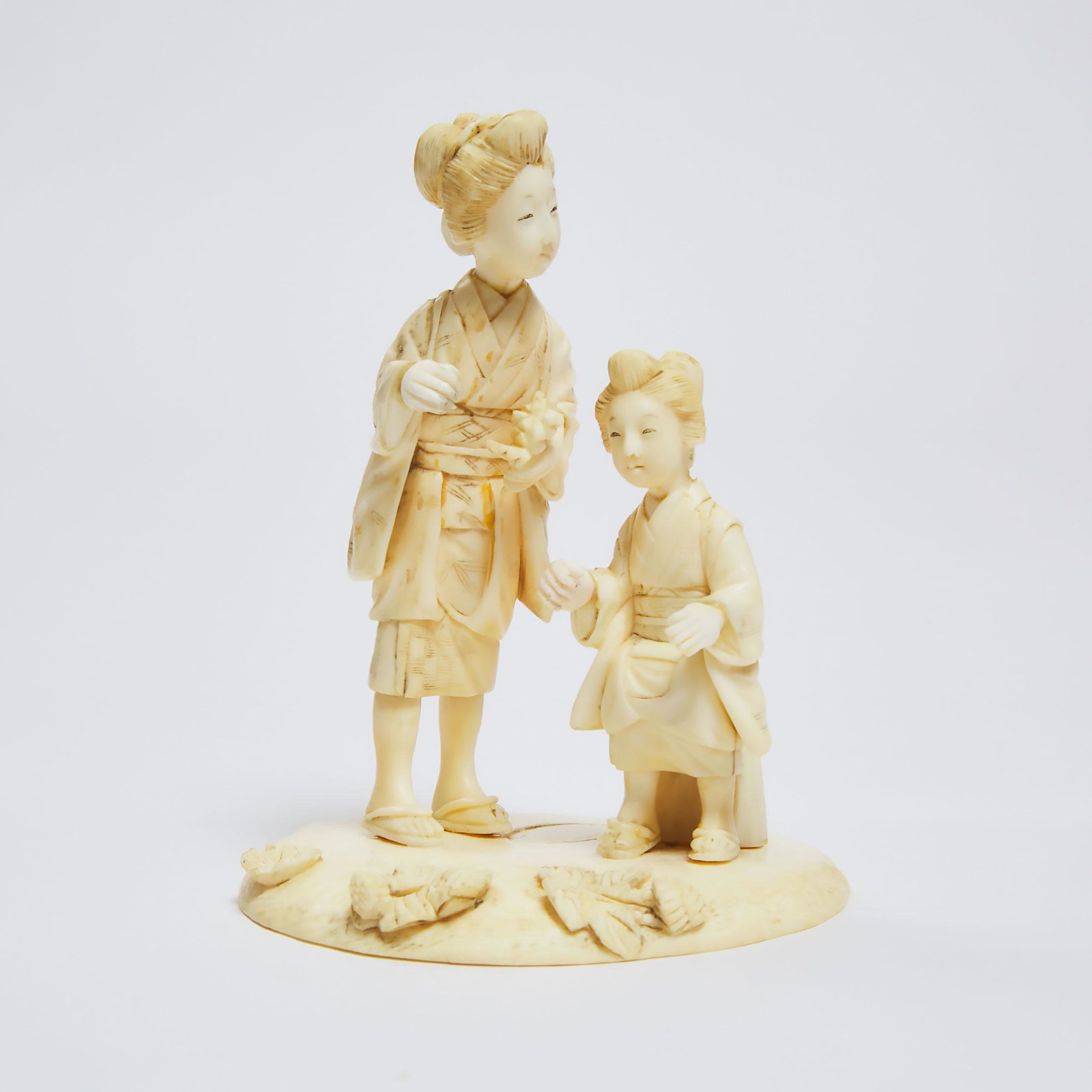 A Japanese Ivory Okimono of A Mother and Child at a Lotus P: A Japanese Ivory Okimono of A Mother and Child at a Lotus Pond, Signed, Meiji Period日本 明治时期 牙雕荷塘母女置物,
