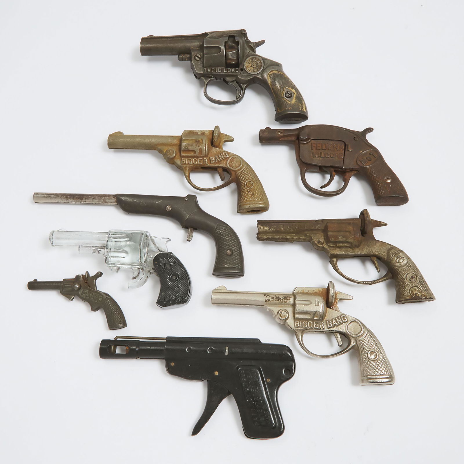 Collection of Eight Cork and Cap Guns, early-mid 20th centu: Collection of Eight Cork and Cap Guns, early-mid 20th centuryincluding a J.E. Stevens 'Rapid Load 6 Shot', a "Federal Kilgore', two 'Bigger Bangs', a miniature 'Pluck' a 'Longboy', and two others, tog