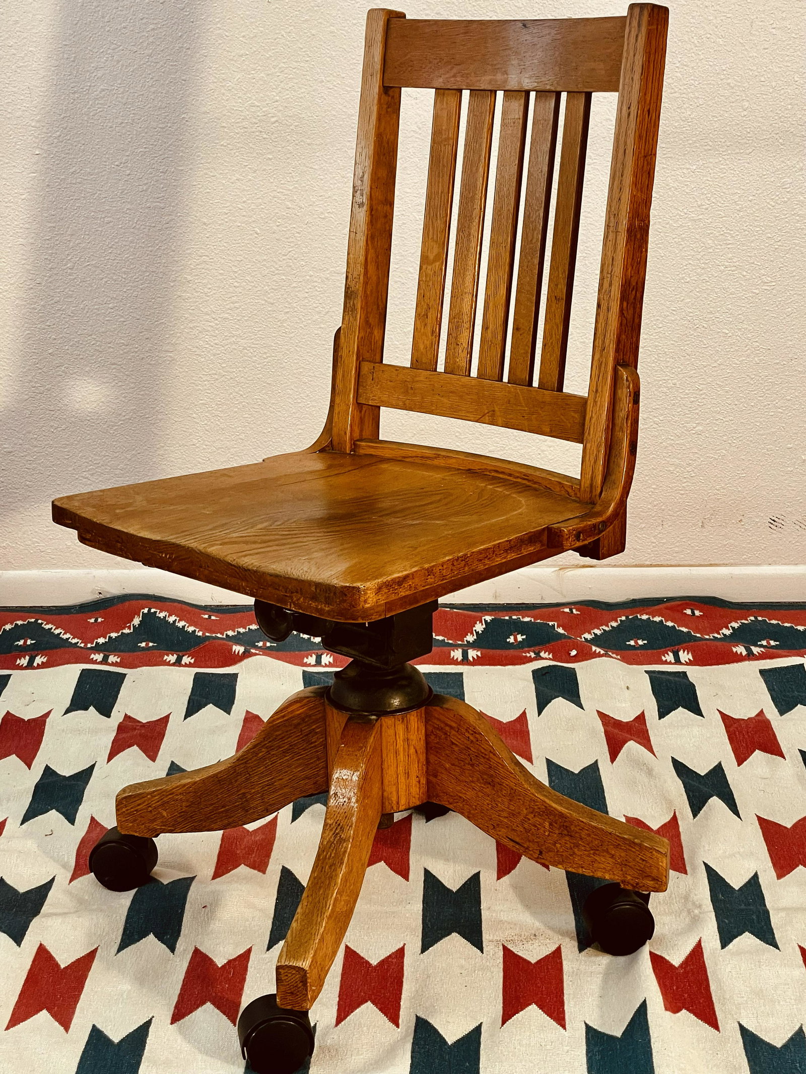 ARTS AND CRAFTS SWIVAL CHAIR: Original finish. New leather seat. Signed with â€œThe Work of L.&JG. Stickley” label. Dimensions: 37”h x 17.5D x 17”w