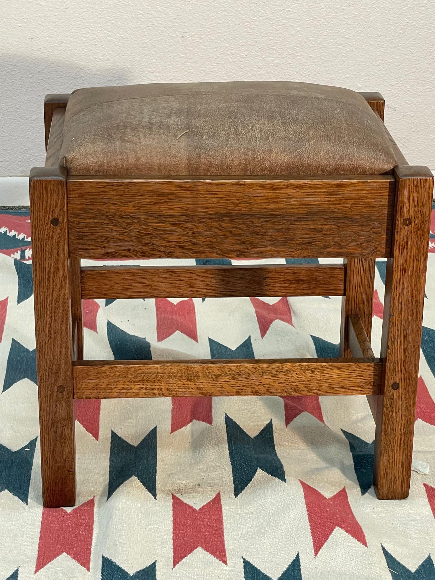 Kingcraft oak footstool: Nicely pinned anf finished. Perfect leather insert. Branded mark Dimensions: 14”h x 18”w x 17”d