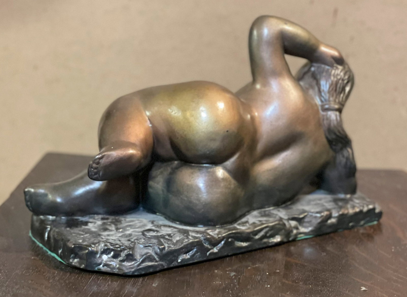 After Botero bronze clad ceramic in the manner of Botero. Signed Maria Mezzeo.: Reclining nude in the manner of Botero. Bronze plated ceramic Signed Maria Mazzeo Dimensions: 6.5″ h x 10″w