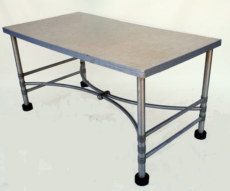 MacArthur Table: 18" High x 36"Wide x 18"Deep …super rare aluminum and formica topped coffee table. Designed and manufactured by Warren Macarthur 1925-1935. Collected in Napier, New Zealand. Roughness to aluminum ba