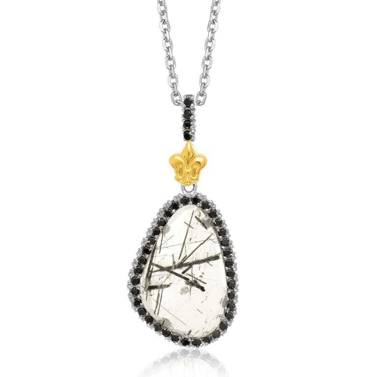 Contemporary Black Spinel Rutilated Quartz Pendant: Crafted in 18K yellow gold & sterling silver, features black spinel bordered rutilated quartz. Adorned with 18K yellow gold fleur-de-lis detailing. measures approx 1.5 inches.