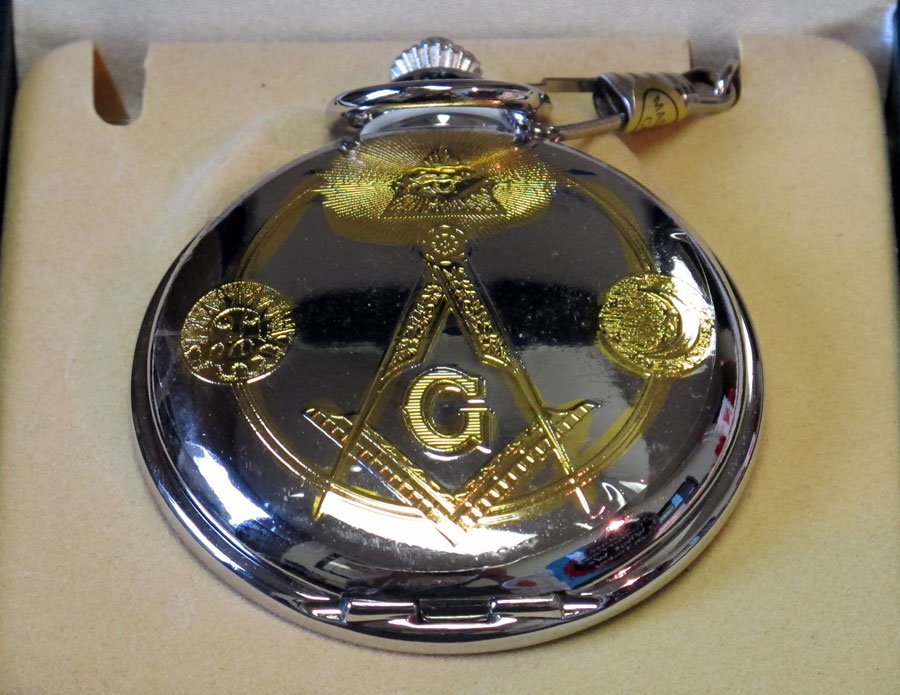 Masonic Style Silver Pocket Watch: Masonic Style Silver Pocket Watch. The outside of the watch features a gold masonic symbol. The inside features blue/gold masonic artwork.