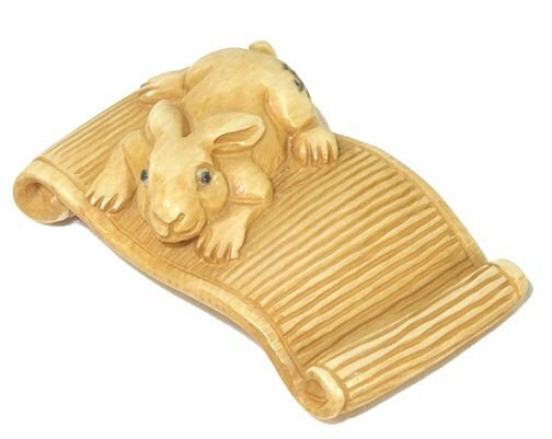 RabbitHand Carved Ivory Netsuke Figure: Hand Carved Ivory Netsuke Figure depicting a rabbit. Measures 1.25" L. Signed.