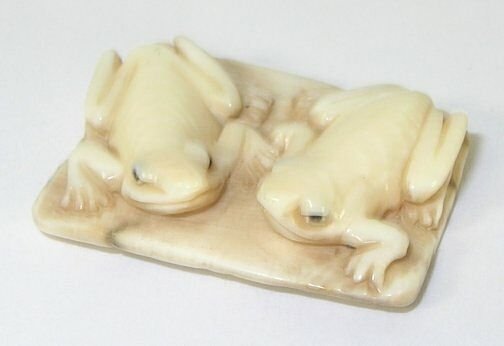 Frogs Hand Carved Ivory Netsuke Figure: Hand Carved Ivory Netsuke Figure depicting frogs. Measures 1.25" L. Signed.