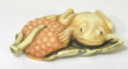Frog Hand Carved Ivory Netsuke Figure: Hand Carved Ivory Netsuke Figure depicting a Frog with Fruit. Measures 1.25" L.