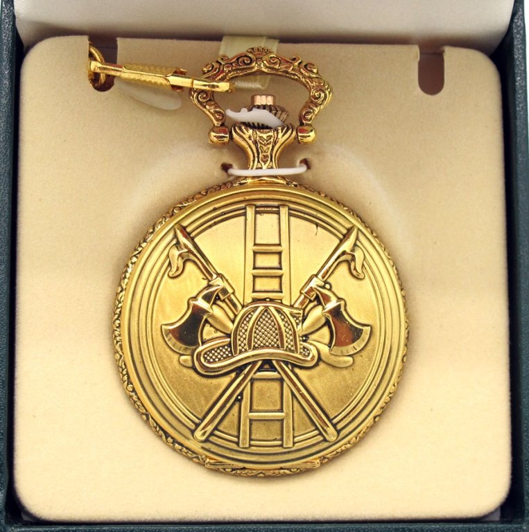 Firefighter Gold Tone Pocket Watch: Firefighter Gold Tone Pocket Watch. The front of the watch features a helmet, crossed axes and pikes and letter in relief. The inside features a maltese FD emblem.